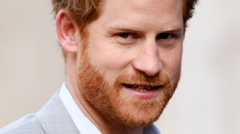 Prince Harry smiles at an event