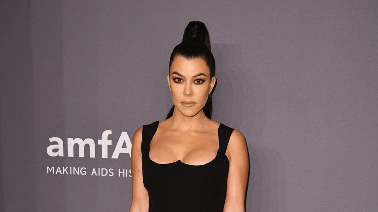 Kourtney Kardashian posing