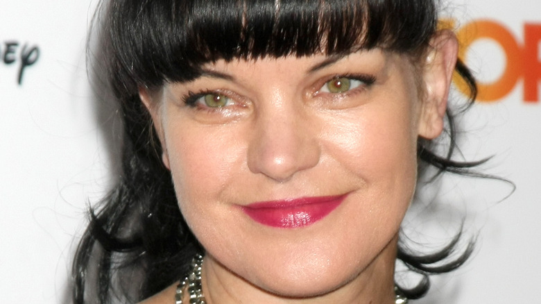 Pauley Perrette with fuchsia lip color
