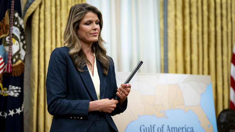 Lindsey Halligan, attorney for U.S. President Donald Trump, holding ceremonial proclamations to be signed by U.S. President Donald Trump in the Oval Office