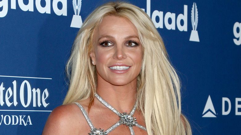 Britney Spears wears a silver dress in 2018