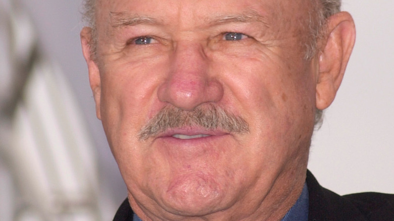 Gene Hackman giving a small smile