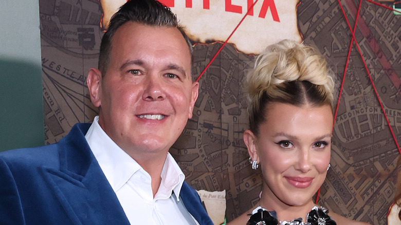 Millie Bobby Brown posing with Robert Brown