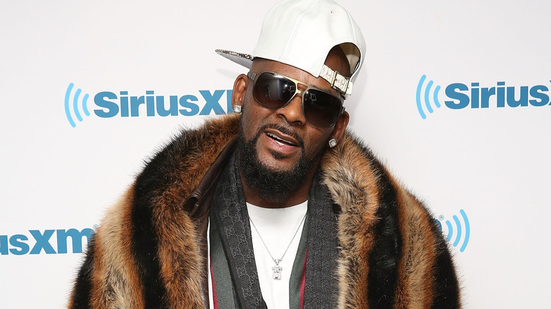 R. Kelly, smirking