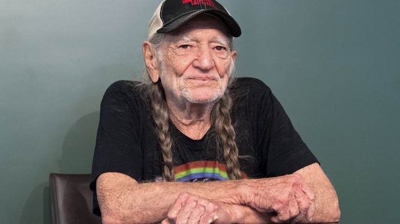 Willie Nelson sitting down