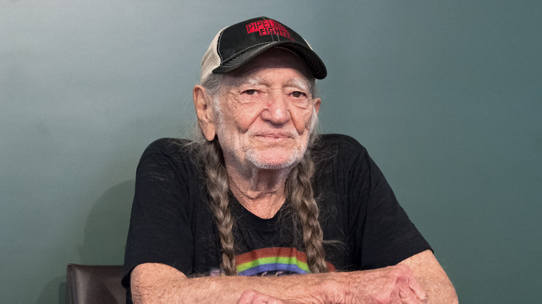 Willie Nelson sitting down