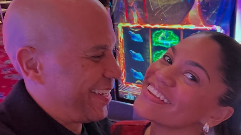 Cory Booker and Alexis Lewis posing for cameras