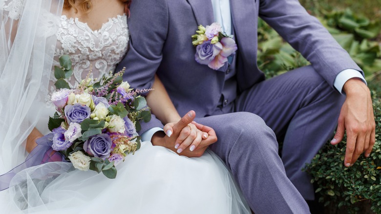 Bride and groom holding hands