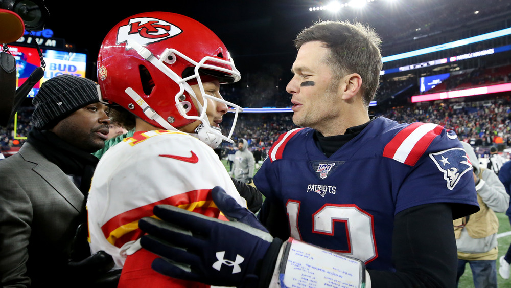 Patrick Mahomes and Tom Brady on the field