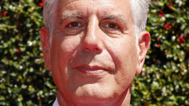 Anthony Bourdain poses in a tux