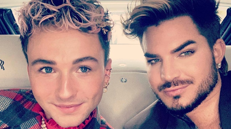 Oliver Gliese smiling in car with Adam Lambert 