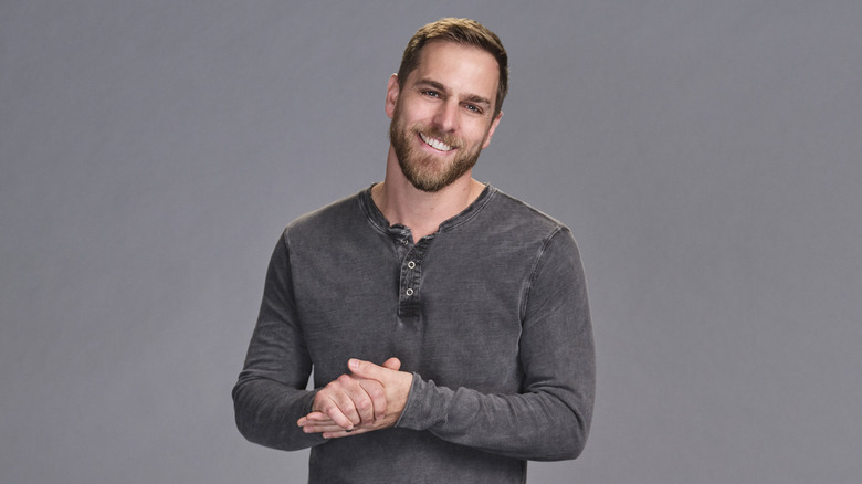 Adam Christoferson with hands clasped