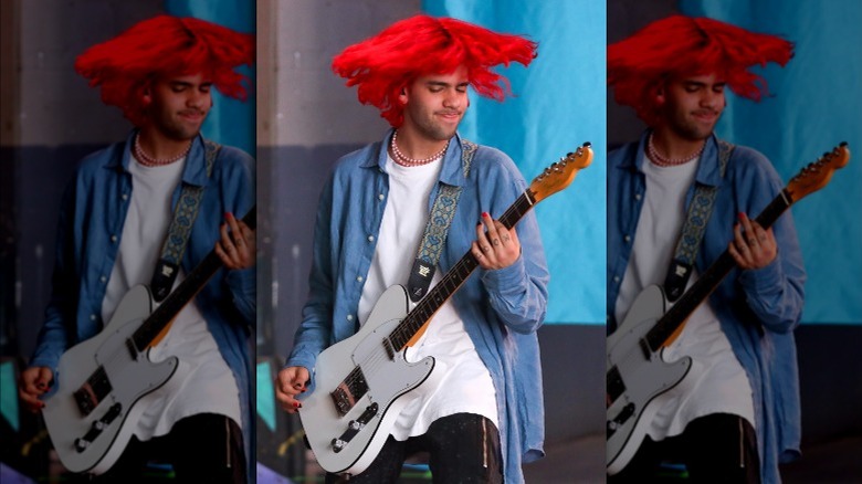 Omer Fedi playing guitar