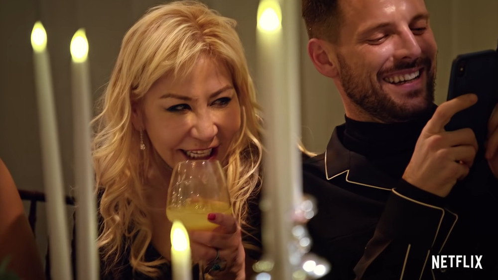 Anna Shay laughing and drinking