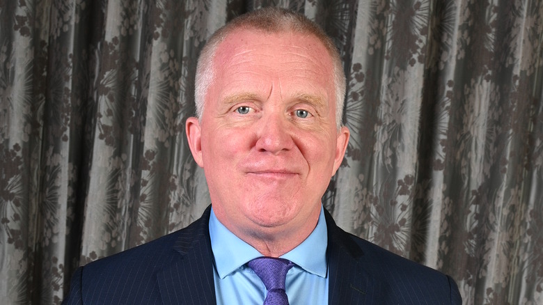 Anthony Michael Hall, smirking