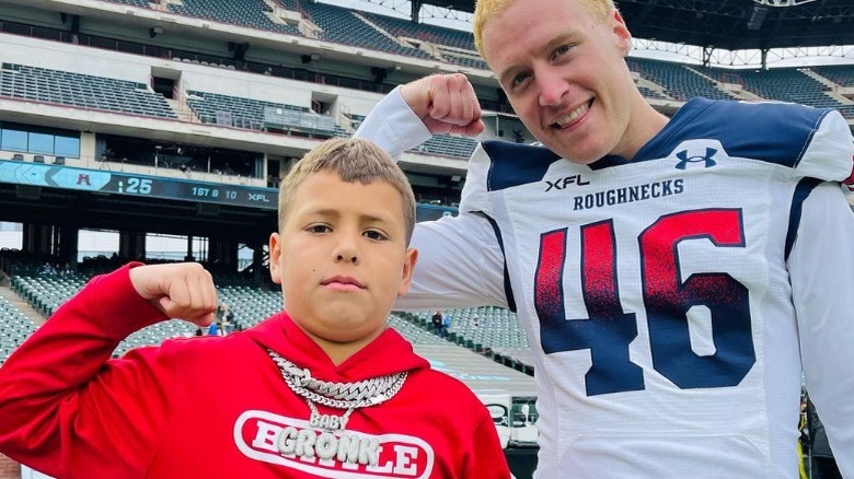 Baby Gronk flexing muscles