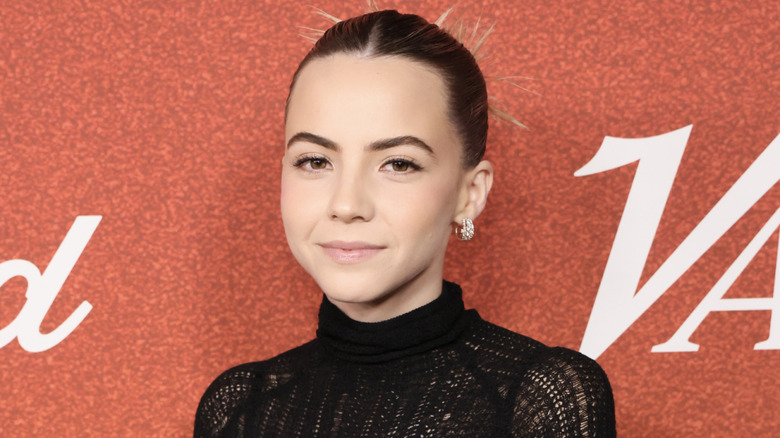 Bobbi Althoff smiling wearing black dress