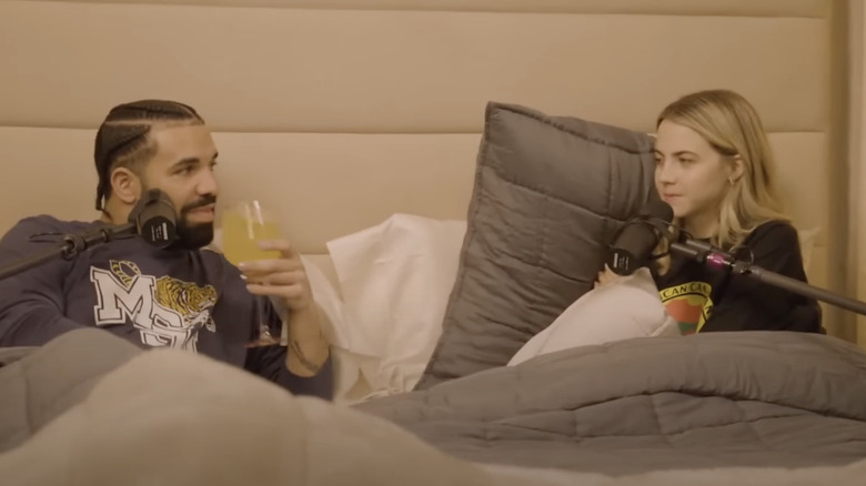 Drake and Bobbi sitting and talking in bed
