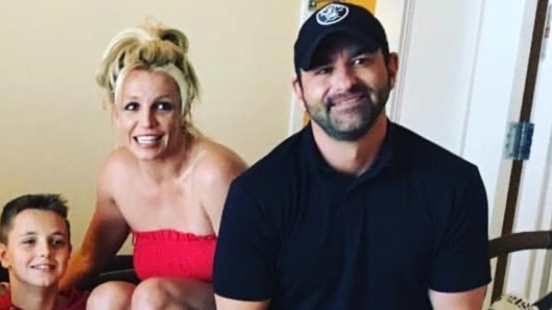 One of Britney's kids, Britney Spears, looking nervous, blond hair up, Bryan Spears, 2018 photo