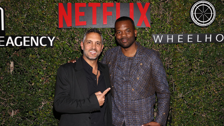 Mauricio Umansky and Brandon Grave posing together and smiling