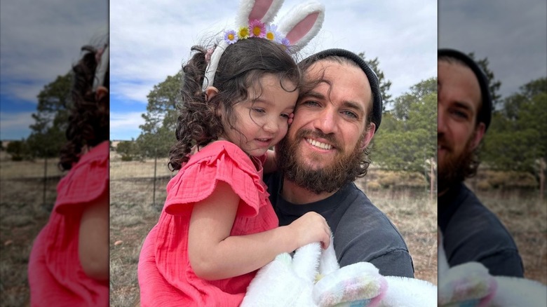 Alex Fine smiling with daughter