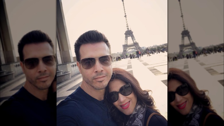 Jon Seda and Lisa Gomez posing in France