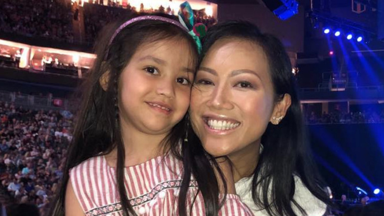 Tina Teigen and her daughter, Pasha, smile at a concert