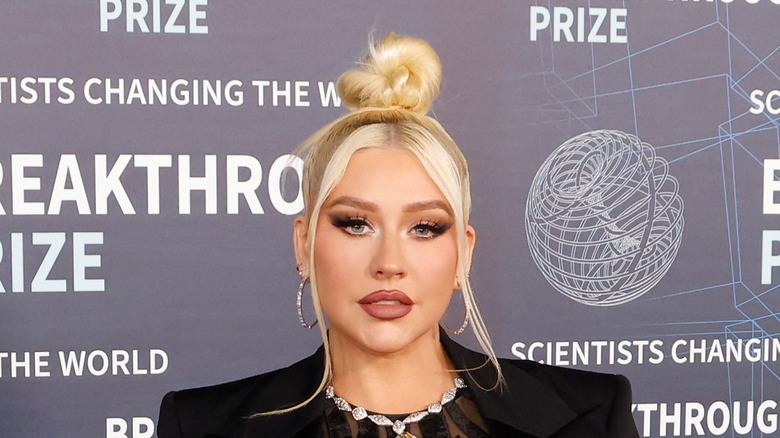 Christina Aguilera wears a black blazer at a 2023 event