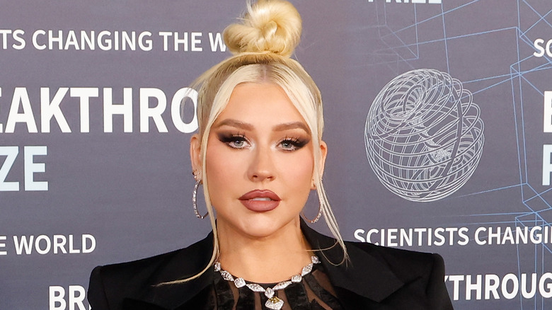 Christina Aguilera wears a black blazer at a 2023 event