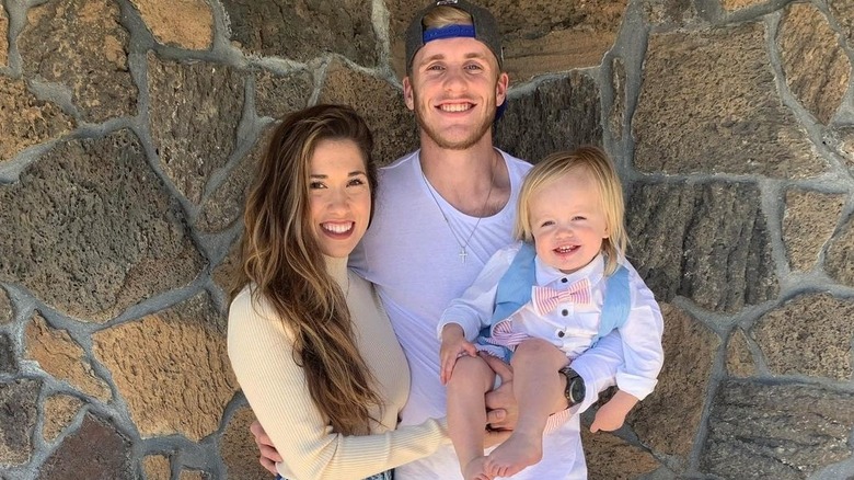 The Kupps pose with their child