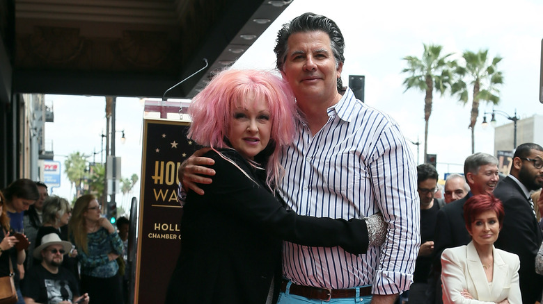 Cyndi Lauper hugging David Thornton