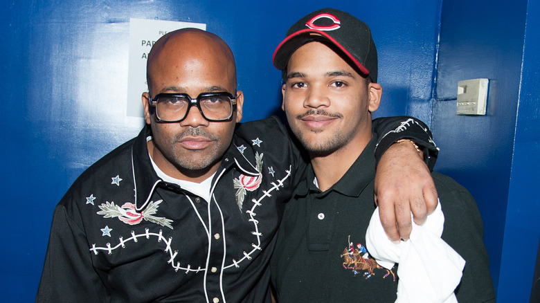 Damon Dash posing with his son Boogie Dash