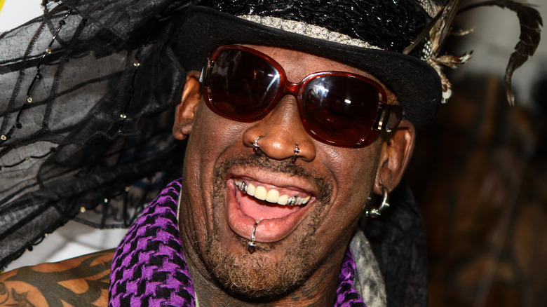 Dennis Rodman pierced face black hat