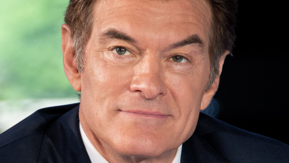 Dr. Oz poses in a dark suit