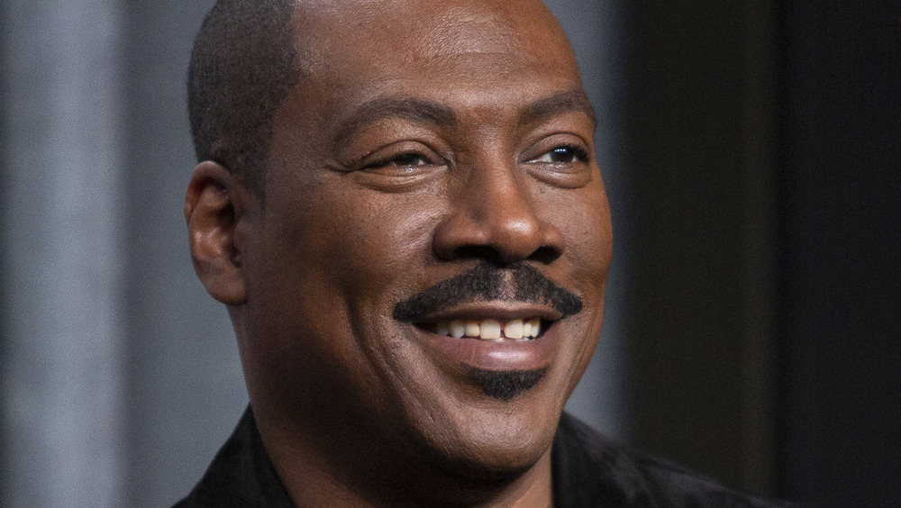 Eddie Murphy smiling at an event