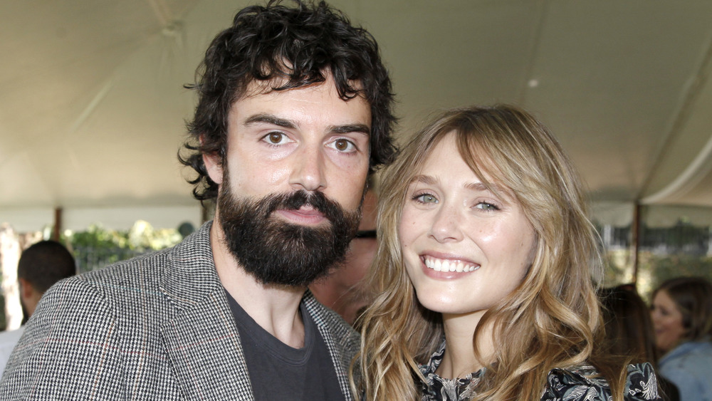 Robbie Arnett and Elizabeth Olsen posing