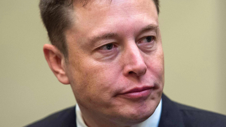 Elon Musk pursing lips