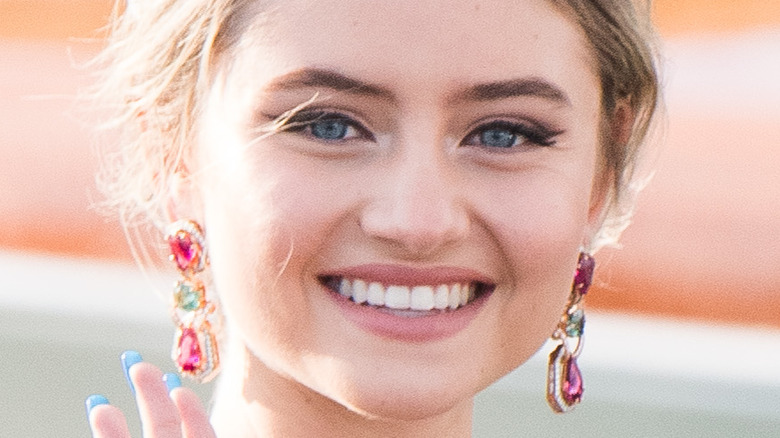 Leni Klum smiling with dangling earrings