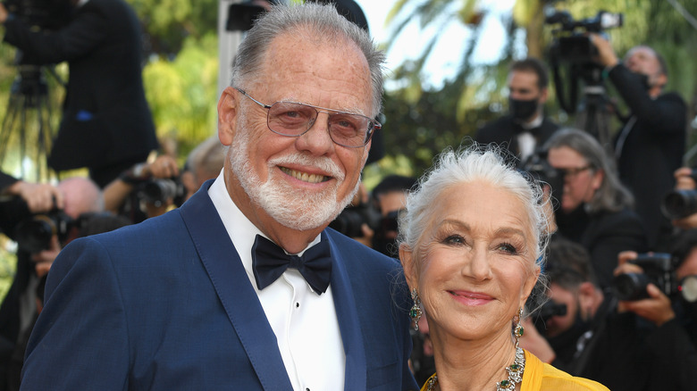 Taylor Hackford posing with wife Helen Mirren