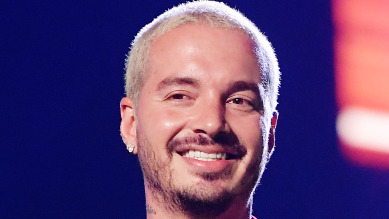 J Balvin smiles on stage