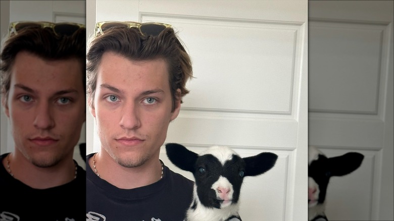Jake Bongiovi posing with an animal 