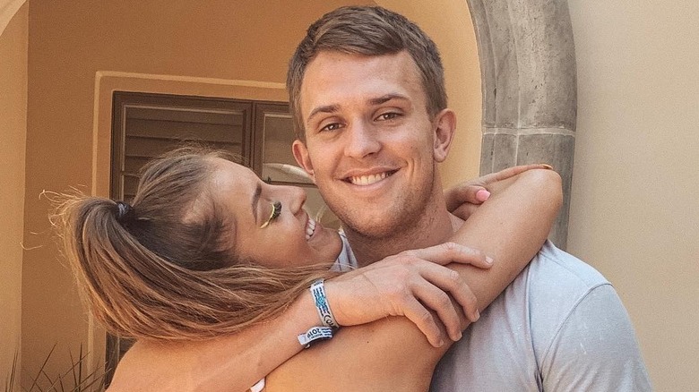 Stephanie Niles hugging Jake Browning