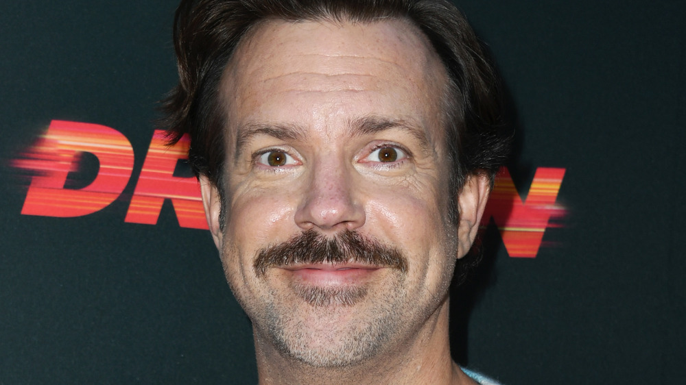 Jason Sudeikis smiling at an event