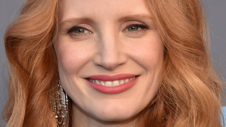 Jessica Chastain smiles in a green dress