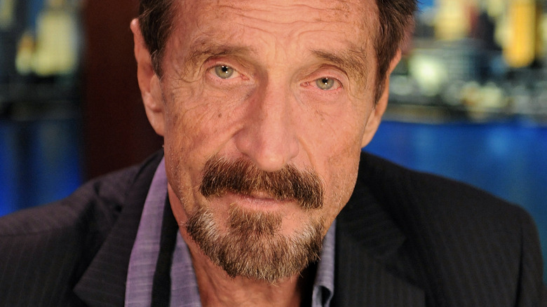 John McAfee looking at camera during interview in 2012