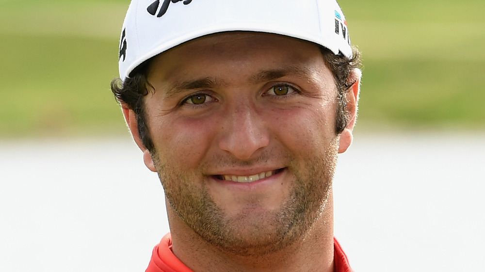 Jon Rahm smiling at golf tournament 