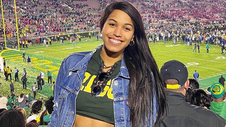 Ronika Stone stands in the crowd at a football game