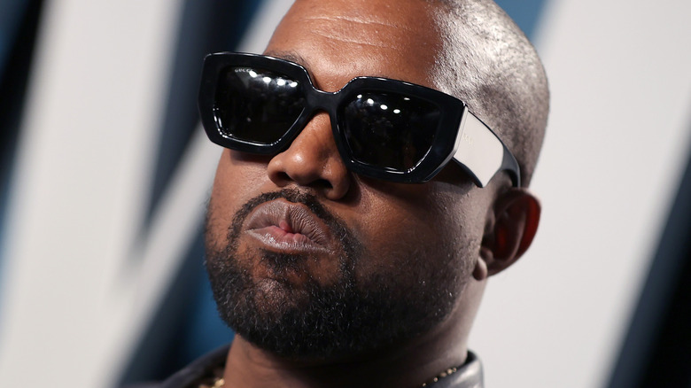 Kanye West wearing black sunglasses