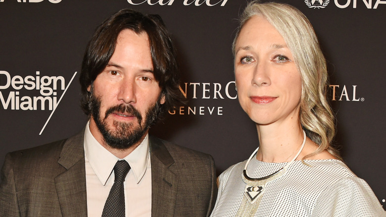 Keanu Reeves and Alexandra Grant pose together