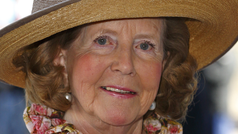 Lady Anne Glenconner posing in hat